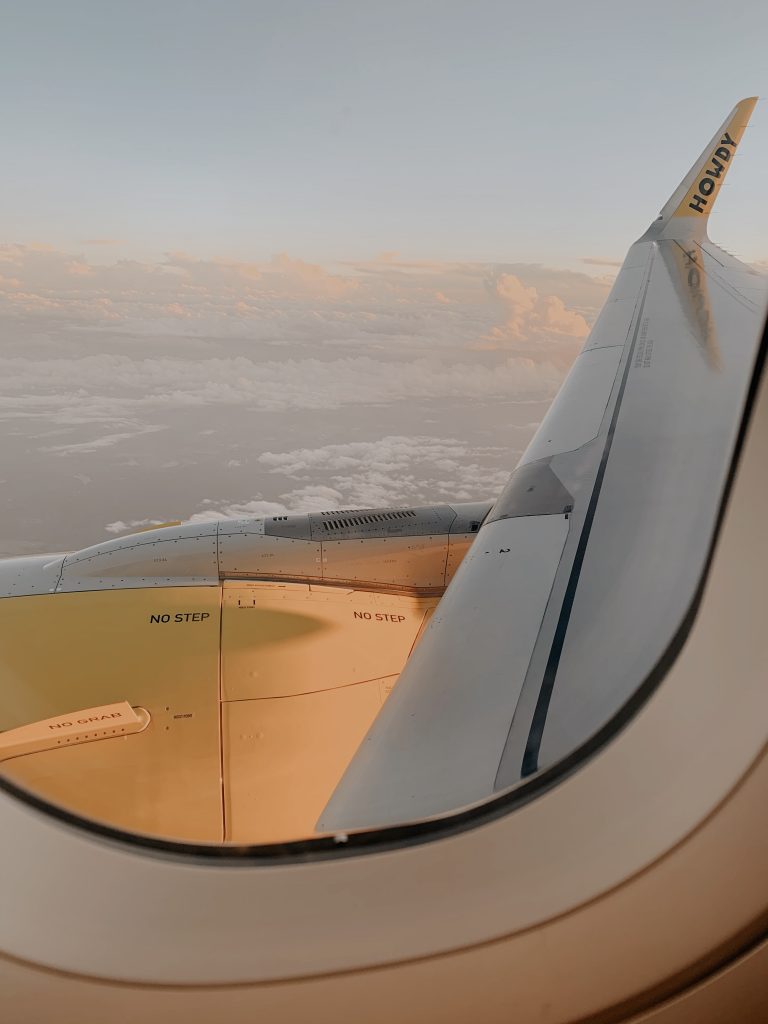 Looking out the window of the airplane