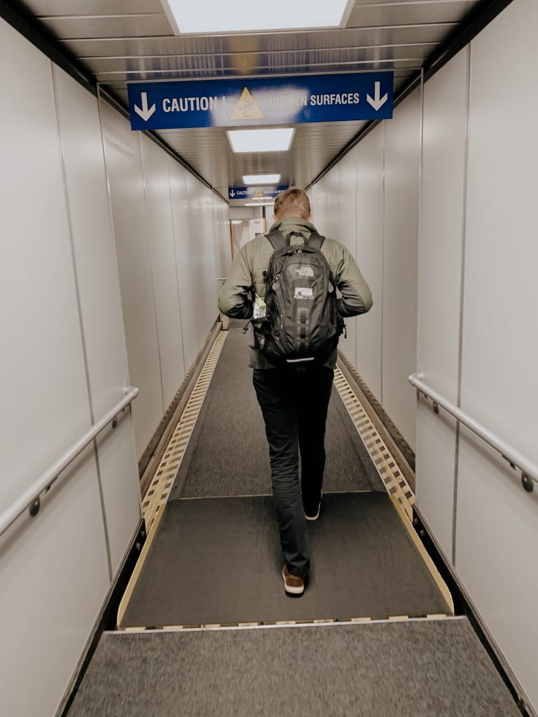 Husband walking onto the plane